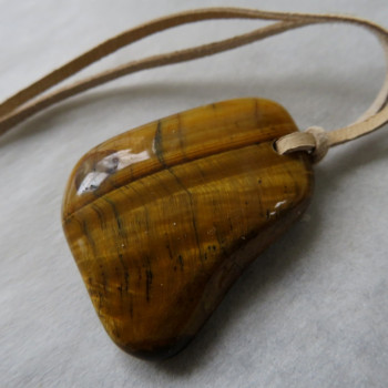 Tiger's eye, drilled stone on skin no.7