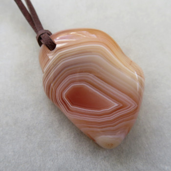 Carnelian Botswana, drilled stone with skin No. 3