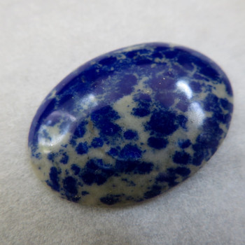 Lapis lazuli-spotted cabochon #18